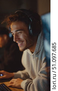 Enjoying an intense gaming session with friends at night in a cozy room filled with excitement and concentration. Стоковое AI-видео, аниматор Сергей Толмачёв / Фотобанк Лори