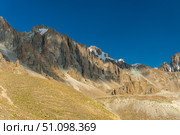 Ala-Archa Rocky mountain slopes, snow patches, steep cliffs, create an ideal environment for trekking, climbing, alpinism, hiking, backpacking, mountaineering, and outdoor adventure activities. Стоковое фото, фотограф Андрей Ка / Фотобанк Лори
