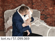 Daddy's Adoration Loving His Baby Daughter Near the Bed at Home. Стоковое фото, фотограф Aleksandr Golubev / Фотобанк Лори