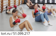 combined exercises and tasks. Students pump abs and lunge with hands and fists, working out speed of boxing punch. Стоковое видео, видеограф Яков Филимонов / Фотобанк Лори