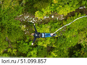 The flight of a man over the abyss on an elastic band. Jump on a ropejumping. Стоковое фото, фотограф Наталия Кирсанова / Фотобанк Лори
