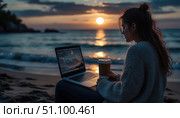 A woman is sitting on the beach with a laptop and a cup of coffee. Стоковое AI-изображение, AI-художник Ярославский Максим / Фотобанк Лори