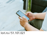 Close-up of a man's hand using AI. Стоковое фото, фотограф Feruza Tashmetova / Фотобанк Лори