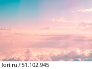 Soft pastel hues painting the sky, with fluffy clouds drifting gently, creating a dreamy and romantic ambiance during a breathtaking sunset filled with vibrant colors. Стоковое фото, фотограф Ольга Ильина / Фотобанк Лори