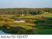 View of the Sorot River valley and an old windmill from Savkina Hill near the Mikhailovskoye estate of the A.S. Pushkin Museum-Reserve on a sunny summer day, Pushkinskiye Gory, Pskov Oblast, Russia. Стоковое фото, фотограф Ula Ulachka / Фотобанк Лори