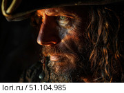 Portrait of a pirate wearing tricorn hat and showing fierce expression. Стоковое AI-изображение, AI-художник Иван Рябоконь / Фотобанк Лори