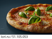 Delicious neapolitan pizza with fresh basil leaves and melted mozzarella on dark background. Стоковое AI-изображение, AI-художник Иван Рябоконь / Фотобанк Лори