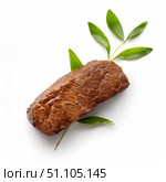Roasted beef brisket with green leaves on white background. Стоковое AI-изображение, AI-художник Иван Рябоконь / Фотобанк Лори