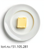 Single piece of butter on white plate resting on white background. Стоковое AI-изображение, AI-художник Иван Рябоконь / Фотобанк Лори