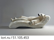 Polar bear relaxing on comfortable fur sofa, promoting wildlife conservation and animal welfare. Стоковое AI-изображение, AI-художник Иван Рябоконь / Фотобанк Лори