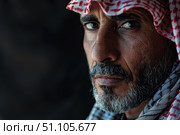 Portrait of bedouin man wearing traditional keffiyeh looking pensively into distance. Стоковое AI-изображение, AI-художник Иван Рябоконь / Фотобанк Лори
