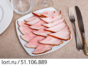 Plate is filled with slices of smoked meat fore shank. Стоковое фото, фотограф Яков Филимонов / Фотобанк Лори