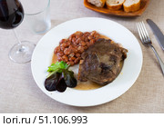 Baked pork cheek with stewed pinto beans and greens. Стоковое фото, фотограф Яков Филимонов / Фотобанк Лори