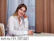 Girl Contemplating Future Plans Over Morning Coffee in Bright Apartment. Стоковое фото, фотограф Aleksandr Golubev / Фотобанк Лори