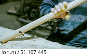 carpenter using nail gun or brad nailer tool on wood box in a workshop ,furniture restoration woodworking concept. selective focus. Стоковое фото, фотограф Feruza Tashmetova / Фотобанк Лори