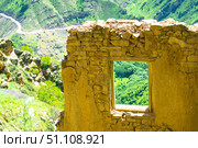 Empty window opening in the ruins of the mountain ghost village of Gamsutl. Caucasus (2024 год). Стоковое фото, фотограф Константин Лабунский / Фотобанк Лори