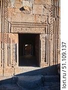 Stepantsminda, Georgia - January 03, 2023: Gergeti Church of the 14th century at the foot of Mount Kazbek. Vintage patterns around the doorway. Редакционное фото, фотограф Наталия Кирсанова / Фотобанк Лори