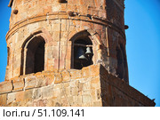 Stepantsminda, Georgia - January 03, 2023: Gergeti Church of the 14th century at the foot of Mount Kazbek. Редакционное фото, фотограф Наталия Кирсанова / Фотобанк Лори