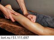 Healing Hands Targeting Calf Muscles Through Massage Therapy. Стоковое фото, фотограф Aleksandr Golubev / Фотобанк Лори