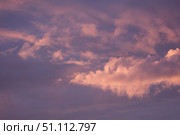 The sky is filled with soft, pink-tinged clouds against a deeper purple backdrop. Concept of: Colorful skyscape. Стоковое фото, фотограф Ольга Петрова-Апостолова / Фотобанк Лори