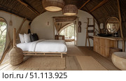 Luxury bedroom with panoramic windows and safari view. Modern hotel suite with natural design. Стоковое AI-изображение, AI-художник Михаил Коханчиков / Фотобанк Лори