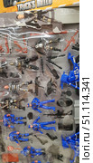 A play set of soldiers and police figures with accessories. The package includes plastic figures of people in blue police uniforms, fighters in black uniforms and a prisoner in striped clothes. Also included are miniature weapons - machine guns, pistols, rifles, grenade launchers, a blue motorcycle, a service dog, road signs and various accessories (backpacks, suitcases, boxes). The set is made in bright colors, each figure has characteristic details - bulletproof vests, belts, helmets. This is a children's toy for role-playing games, imaginary battles and scenes of police operations. (2018 год). Редакционное фото, фотограф Анна Кривицкая / Фотобанк Лори