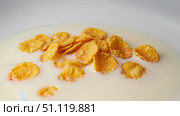 A bowl of golden cornflakes lightly dipped in creamy milk. The perfect breakfast for a cheerful morning, which will delight with taste and crunch. Стоковое AI-изображение, AI-художник Светлана  Громак / Фотобанк Лори