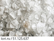 Coarse white crystals of himalayan pink salt forming an abstract textured background. Стоковое AI-изображение, AI-художник Иван Рябоконь / Фотобанк Лори