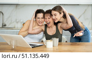 Women are sitting at computer and are immensely happy. Стоковое фото, фотограф Яков Филимонов / Фотобанк Лори