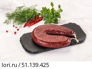 Delicious dry cured beef basturma on table, closeup. Стоковое фото, фотограф Андрей Старостин / Фотобанк Лори