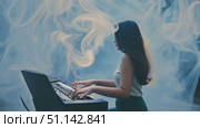 A talented musician creates enchanting melodies on the keyboard in a fog-filled studio. Стоковое AI-видео, аниматор Данила Большаков / Фотобанк Лори
