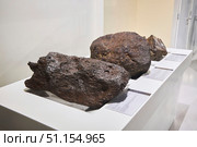 Moscow, Russia - March 21, 2023: Moscow Planetarium. The meteorite found. Редакционное фото, фотограф Наталия Кирсанова / Фотобанк Лори