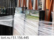 Stacked Glass Panels Securely Wrapped for Transportation. Стоковое фото, фотограф Аксенова Вера / Фотобанк Лори