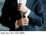 Men's hands correct shirt with cufflinks. Стоковое фото, фотограф Наталия Кирсанова / Фотобанк Лори