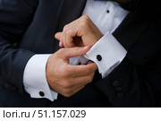 Men's hands correct shirt with cufflinks. Стоковое фото, фотограф Наталия Кирсанова / Фотобанк Лори