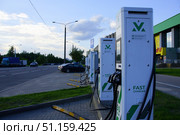 A row of electric charging stations with a green. Belarus. Minsk. 09.08.25. Стоковое фото, фотограф Ярославский Максим / Фотобанк Лори