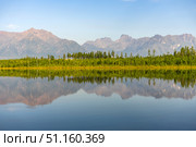Mountain lake calm water with reflection, surrounded by forest, mountain range. Стоковое фото, фотограф Екатерина Якименко / Фотобанк Лори