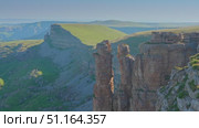 4k, A panoramic aerial view of the Two Monks rock on the Bolshoy Bermamyt plateau, North Caucasus, without people, at daytime, Stavropol Krai, Russia. Стоковое видео, видеограф Сергей Богомяко / Фотобанк Лори