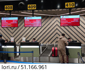 Стойки регистрации авиакомпании Air China в аэропорту Шереметьево. Редакционное фото, фотограф Мария Сергеева / Фотобанк Лори