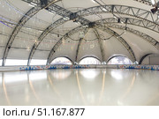 Winter, sport, architecture and leisure concept - ice skating rink indoors. Empty hockey field, arena with ice for product display, copy space. Стоковое фото, фотограф Ирина Михайличенко / Фотобанк Лори