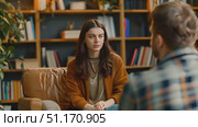 A tense conversation unfolds in a library setting as two individuals explore personal growth and self-discovery. Стоковое AI-видео, аниматор Данила Большаков / Фотобанк Лори