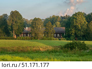 View of the Osipov-Wolf House Museum in the Trigorskoye Estate of Pushkin Natural Landscape Reserve on a sunny summer day, Pushkinskiye Gory, Pskov Region, Russia. Стоковое фото, фотограф Ula Ulachka / Фотобанк Лори