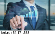 A business expert interacts with digital financial analytics in a bright, contemporary office space. Стоковое AI-видео, аниматор Данила Большаков / Фотобанк Лори