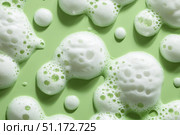 Beauty Product Foam Soap. Abstract background white soapy foam flowing texture. Shampoo foam with bubbles. Bubble surface isolated on a green color. Chroma key. Suds. Facial cleanser. Froth Pattern. Стоковое AI-изображение, AI-художник Марина Демидюк / Фотобанк Лори