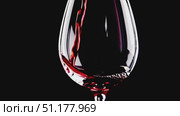 Medium shot of a tulip wine glass from a lower angle; the pour lands visibly on the surface, creating ripples and a fine foam ring. 4K MP4, no people. Стоковое AI-видео, аниматор Владислав Войтов / Фотобанк Лори