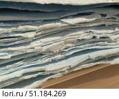 Close-up of stacked blue paper sheets creating textured abstract pattern, suitable as background. Стоковое фото, фотограф Анастасия Золотницкая / Фотобанк Лори