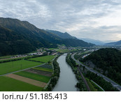 Serene aerial view of river valley in Tyrol, Austria. Стоковое фото, фотограф Данил Руденко / Фотобанк Лори
