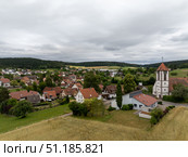 Panoramic view featuring Waldachtal village, church, and wheat fields in Germany. Стоковое фото, фотограф Данил Руденко / Фотобанк Лори