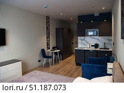 Modern Living Inside a Studio Apartment With Kitchen and Dining Area. Стоковое фото, фотограф Aleksandr Golubev / Фотобанк Лори