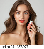 A beautiful girl is holding a tube of cosmetics, face, hand, skin cream. Cosmetics advertising. Стоковое AI-изображение, AI-художник Ирина Гильмуллина / Фотобанк Лори